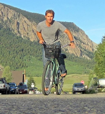 Picture of Roy Moranz riding a beach cruiser in Crested Butte.