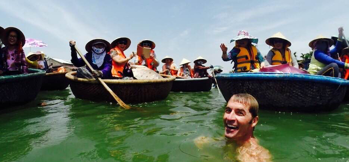 Picture of Roy Moranz swimming with basket boats in Vietnam.
