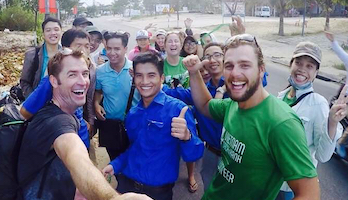 Picture of Roy Moranz, keep Vietnam Green, trash pickup on beach.